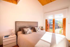 En eller flere senge i et værelse på Casa Nieves