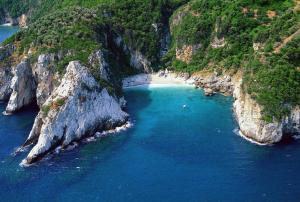an aerial view of a beach between two cliffs at Archontiko Michael Pelion in Vyzitsa +152 photos