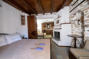 A bed or beds in a room at Archontiko Michael Pelion