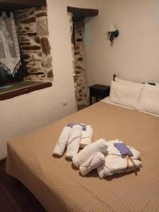 A bed or beds in a room at Archontiko Michael Pelion