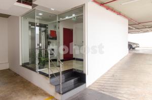 a glass elevator in a building at Cozy Loft, Few Meters From Mariscal Lopez in Asuncion