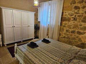 Postel nebo postele na pokoji v ubytování Unique Farmhouse in the Heart of Gozo - Nadur