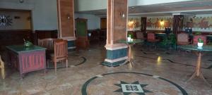a room with tables and chairs in a building at THE WYTE FORT in Cochin