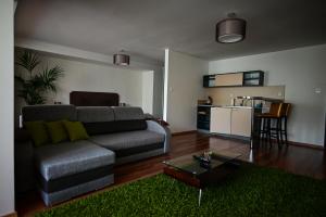 a living room with a couch and a table at Hotel OSTREDOK in Demanovska Dolina