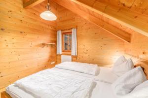 Letto o letti in una camera di Chalet Dachsteinblick