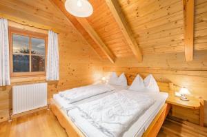 Letto o letti in una camera di Chalet Dachsteinblick