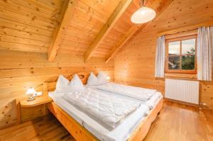 Letto o letti in una camera di Chalet Dachsteinblick