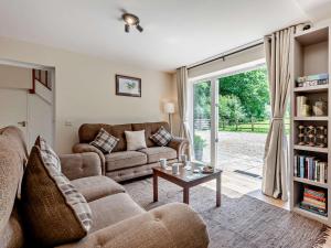 a living room with a couch and a table at 3 bed property in Sturminster Newton Dorset RCORN in Sturminster Newton