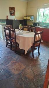 a table with two chairs and a table with at Doornspruit Farm in Magaliesburg