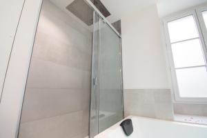Kúpeľňa v ubytovaní L'Appartement des Ducs avec Baignoire Double