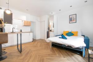 Posteľ alebo postele v izbe v ubytovaní L'Appartement des Ducs avec Baignoire Double