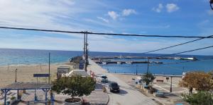 a view of a beach and the ocean at SEA VIEW in Nea Skioni +9 photos
