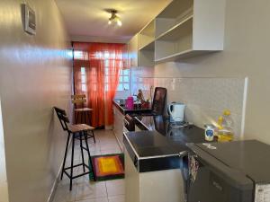 a kitchen with a sink and a counter top at J L appartment in Eldoret