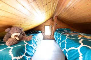 Postel nebo postele na pokoji v ubytování Camping Le Lac des Sapins