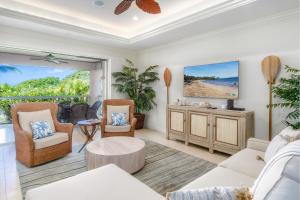 a living room with a couch and chairs and a tv at Ho'olei Unit 12-2, Close to Pool, Walk to Beach in Wailea