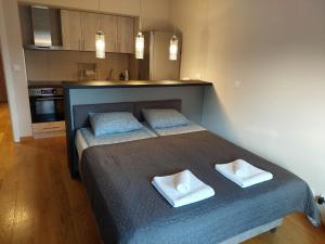 Postel nebo postele na pokoji v ubytování Apartment Premier 1 A Blok