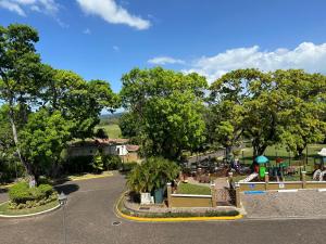 an aerial view of a park with trees and a street at Golf Course in Cocolí