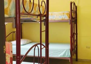 a room with two bunk beds in a room at Paraíso Costero en Alquiler in Playas