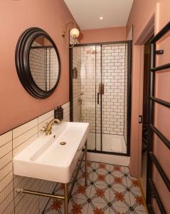 a bathroom with a sink and a shower at Eype's Mouth Country Hotel in Bridport