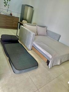 a bed sitting on the floor in a room at Roma Flats in Campo Novo do Parecis