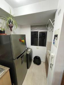 Una cocina o zona de cocina en Moderno y Acogedor apartamento