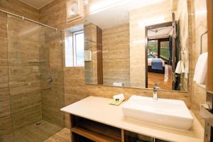 a bathroom with a sink and a shower at Allure lake front in Nainital