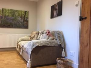 a bed with a blanket on it in a room at 1 Bed in Colchester 58576 