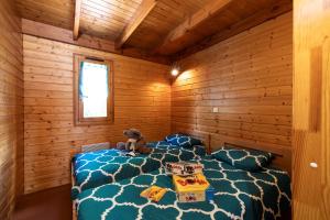 Postel nebo postele na pokoji v ubytování Camping Le Lac des Sapins