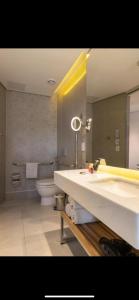 a bathroom with a sink and a toilet at Hotel Nacional Rio de Janeiro in Rio de Janeiro