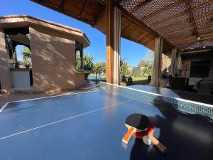 a ping pong ball on top of a ping pong table at Authentic Villa Ideal for 16+ guests in Marrakesh