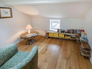 a living room with a couch and a table with books at 2 Bed in Beverley 75584 in Lund