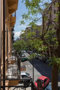 a view of a city street from a balcony at casa mo room and suite in Palermo