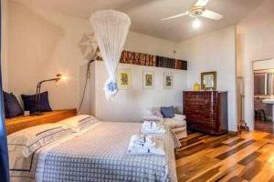 Posteľ alebo postele v izbe v ubytovaní GOCCE VILLAS - Sunshine Villa