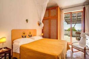 Posteľ alebo postele v izbe v ubytovaní GOCCE VILLAS - Sunshine Villa + 37 fotografií