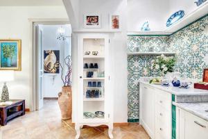 A kitchen or kitchenette at GOCCE VILLAS - Villa Partenope Spectacular Sea View