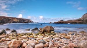 a large group of rocks on a beach at Glencolumbkille House - Self Catering Rooms in Glencolumbkille