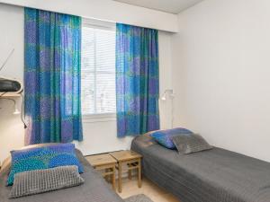 Ένα ή περισσότερα κρεβάτια σε δωμάτιο στο Holiday Home Moitakuru a22 by Interhome