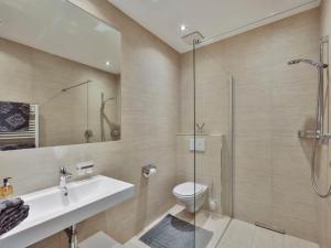 a bathroom with a shower and a toilet and a sink at Apartment Studio 1 by Interhome in Ischgl