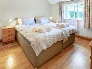a bedroom with a bed with two pillows on it at 2 Bed in Llangenny BN284 in Llangenny