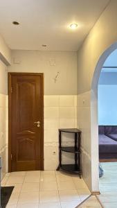 a room with a door and a room with a bed at Квартира посуточно in Almaty