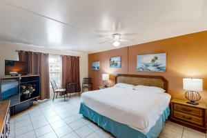 a hotel room with a bed and a television at Gulfview I #312 in South Padre Island