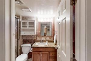 a small bathroom with a toilet and a sink at Gulfview I #312 in South Padre Island +14 photos