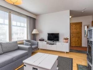 Et tv og/eller underholdning på Holiday Home Moitakuru b 26 by Interhome