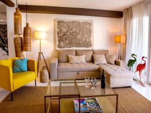 a living room with a couch and a table at Apartment Vista del Arenal by Interhome in Jávea +29 photos