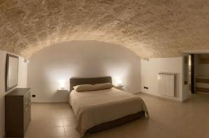 Tempat tidur dalam kamar di Dimora Castello