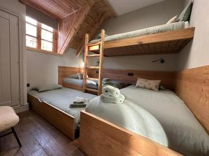 a bedroom with two bunk beds and a window at WOW views next to the ski lift! in Baqueira-Beret