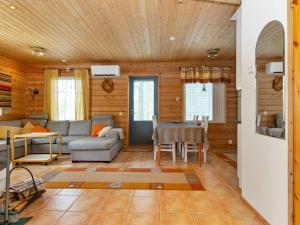 a living room with a couch and a table at Holiday Home Velho 2 by Interhome in Saariselka