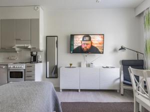 a living room with a tv on a wall at Holiday Home Rautulampi h 23 by Interhome in Saariselka