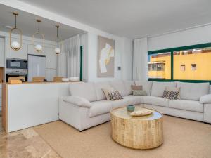 a living room with a couch and a table at Apartment Los Almendros I by Interhome in Marbella