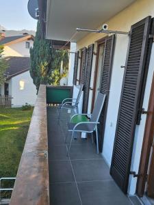 a patio with chairs on the side of a house at Ferienwohnung Alpencity in Garmisch-Partenkirchen